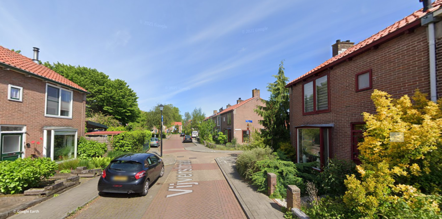 Residential street with traffic calming (before)