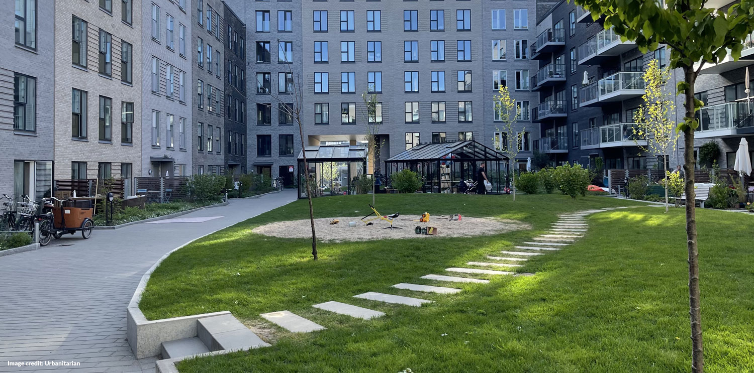 Safe courtyard with community glasshouse (before)
