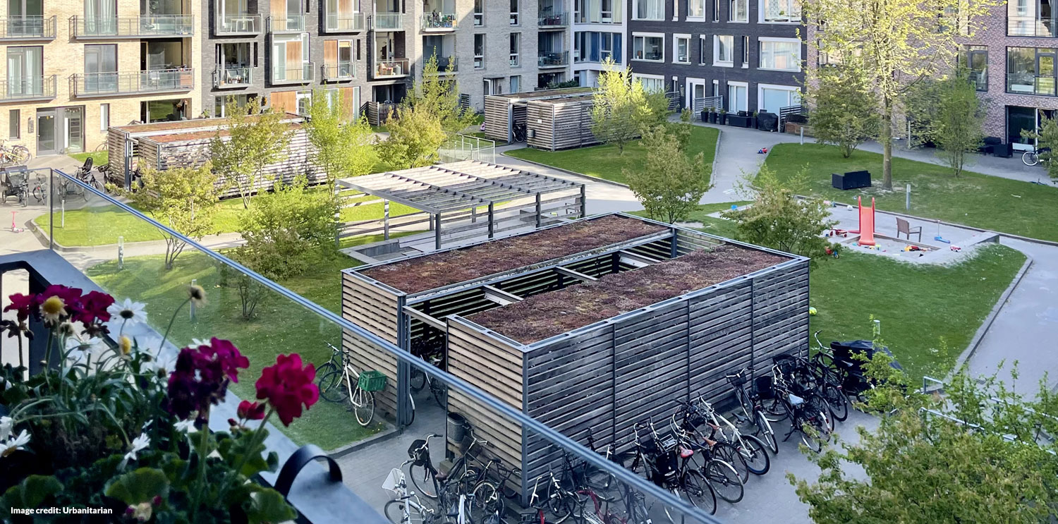 Community courtyard with cycle sheds (before)